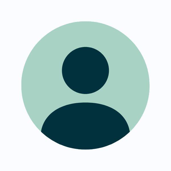 A dark teal silhouette of a person's head and torso is centered within a light teal circle, resembling a default profile picture.